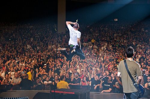 Chester jumping into the crowd during performance